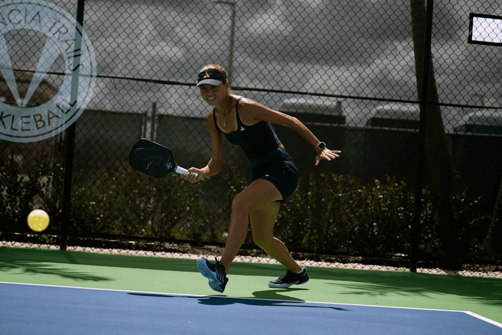 Action shot of Simone Jardim playing pickleball on the court