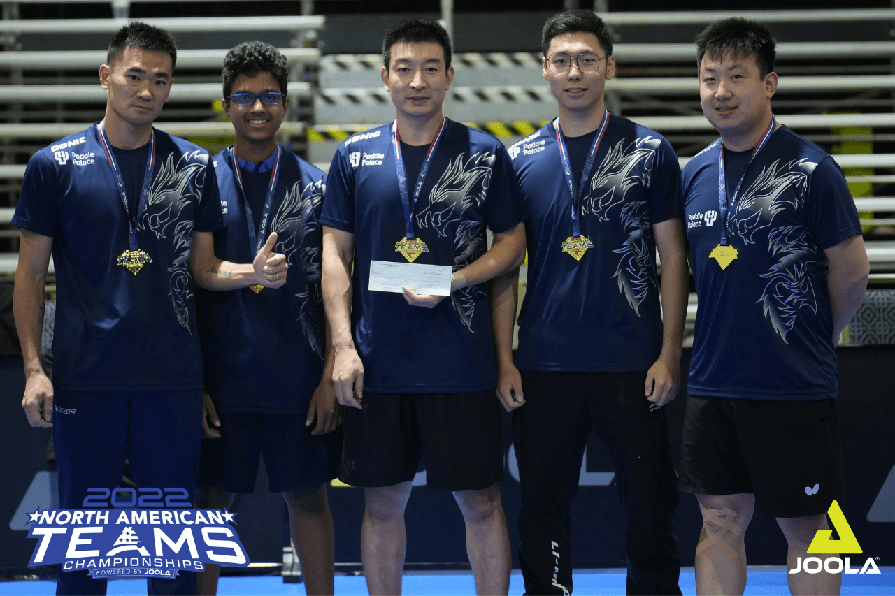 Group of 5 male players posing with gold medals around their necks at the 2022 JOOLA North American Team Championships